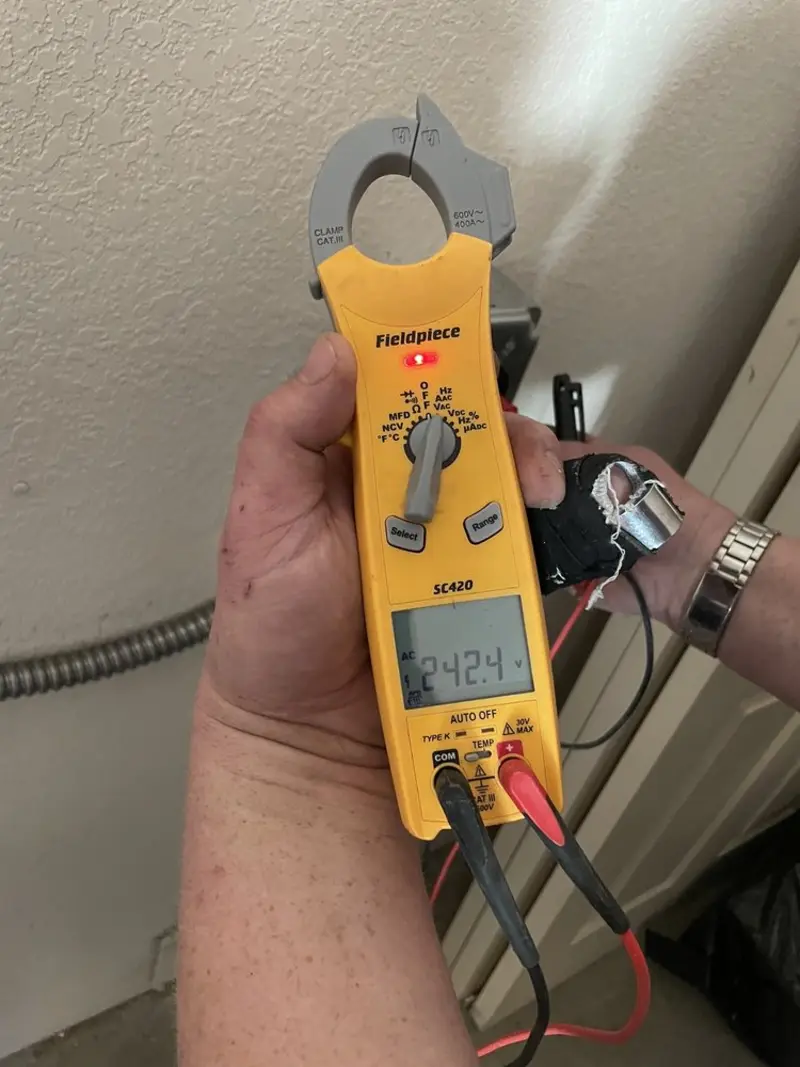 Voltage testing with clamp meter during Circuit Breaker Repair in Palmer Town
